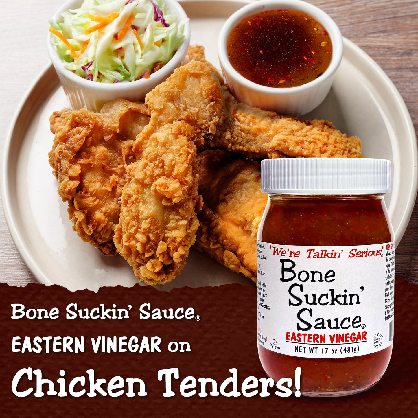 Fried chicken tenders with coleslaw and a small bowl of sauce on a plate, featuring Bone Suckin' Sauce Eastern Vinegar.