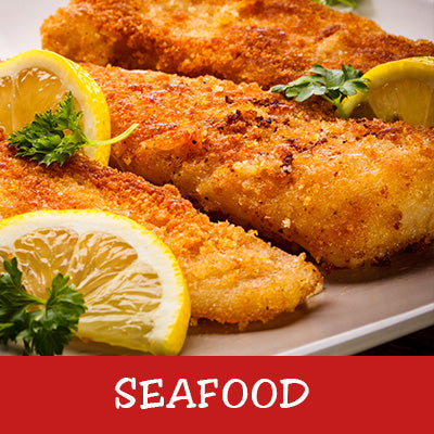 Fried seafood fillets with lemon wedges and parsley on a plate, labeled 'Seafood'.
