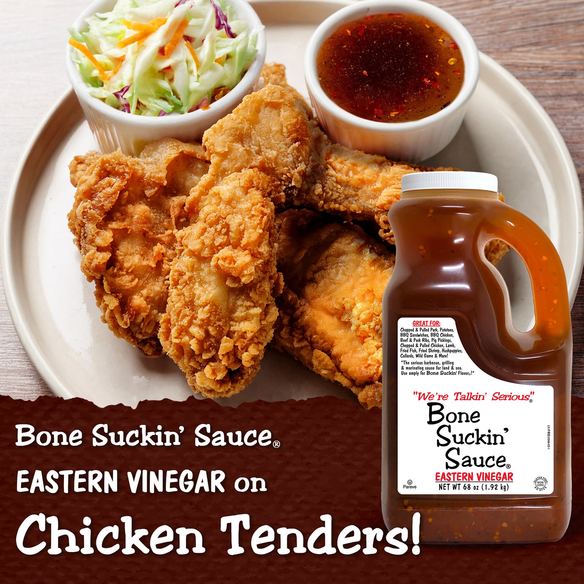 Fried chicken tenders with coleslaw and a bottle of Bone Suckin' Sauce on a plate. - Bone Suckin' Sauce Eastern Vinegar on Chicken Tenders!