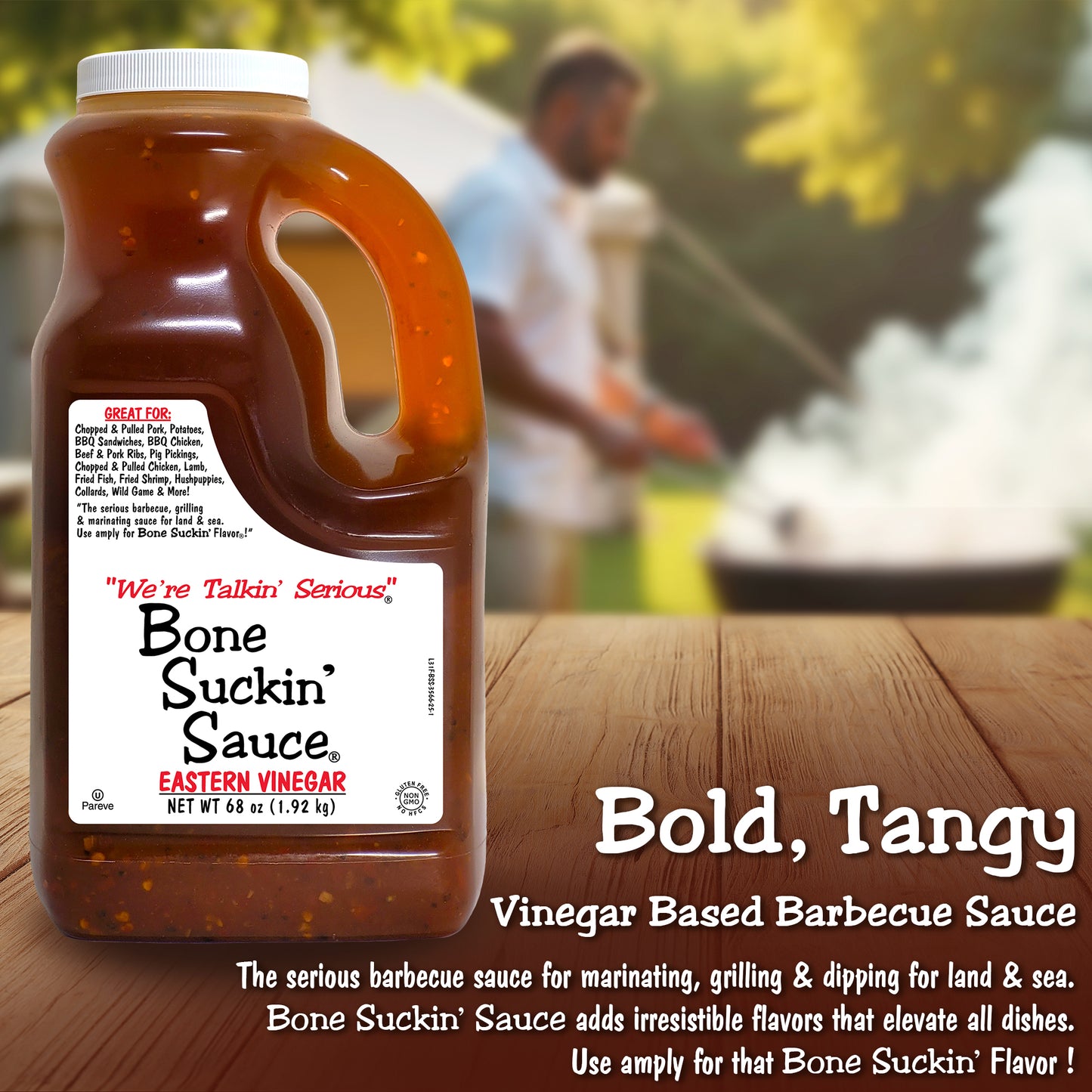 Bone Suckin' Sauce 68 oz jug with a blurred background of a man grilling outdoors. - Bold, Tangy Vinegar-based barbecue sauce. The serious barbecue sauce for marinating, grilling & dipping for land & sea. Bone Suckin' Sauce adds irresistible flavors that elevate all dishes. Use amply for that Bone Suckin' Flavor!