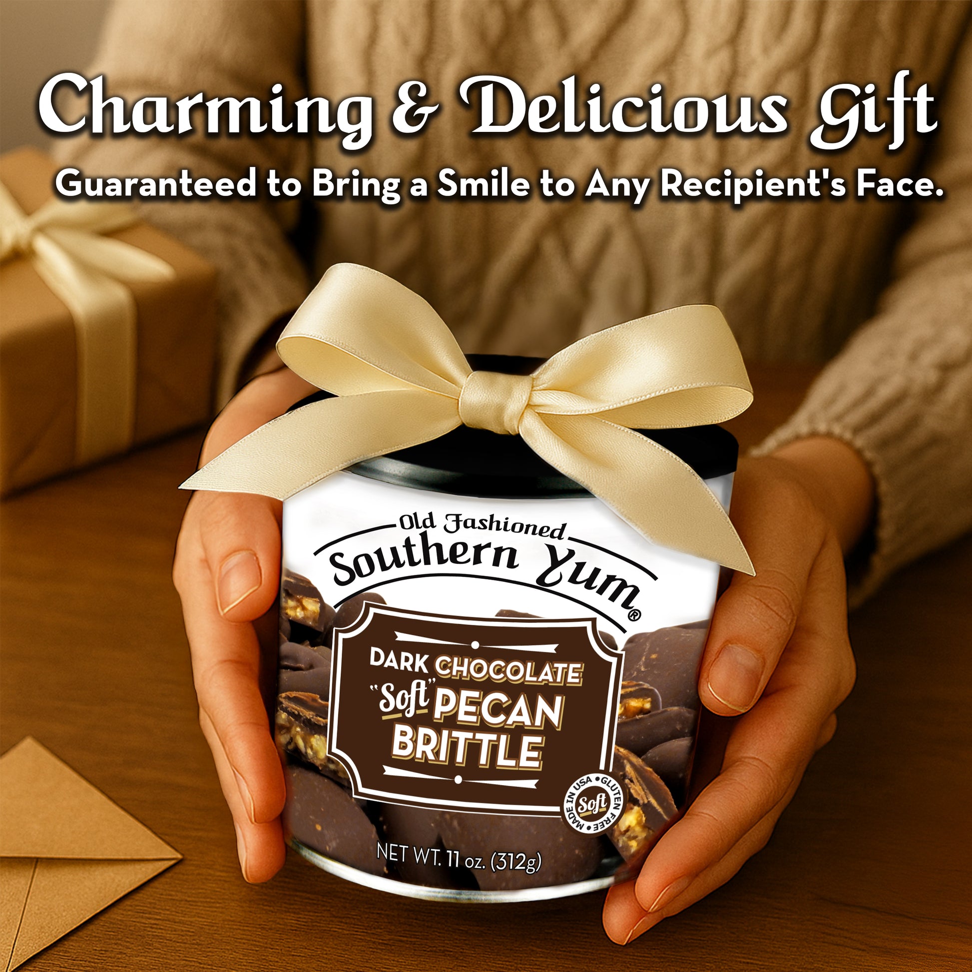 Jar of Old Fashioned Southern Yum Dark Chocolate Soft Pecan Brittle with a bow, held by hands on a wooden surface.