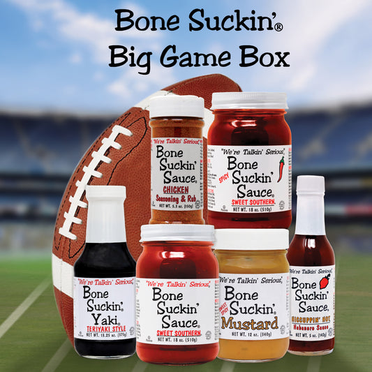 Bone Suckin Big Game Box - Bone Suckin' Chicken Seasoning & Rub, Bone Suckin' Sauce Spicy Sweet Southern, Bone Suckin' Yaki, Bone Suckin' Sauce Sweet Southern, Bone Suckin' Sweet Spicy Mustard, and Bone Suckin' Hiccuppin' Hot Sauce in a football field with a football.