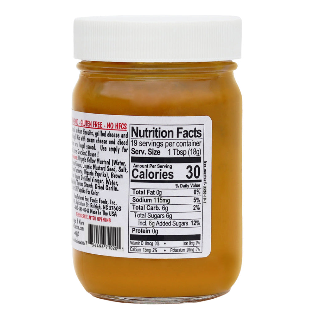 Bone Suckin' Mustard 12 oz. Nutritional Facts Information: Serving Size 1 Tbsp. (18g), Servings Per Container 19, Calories 30, Total Fat 0g (0%), Sodium 115mg (5%), Total Carbohydrate 6g (2%), Total Sugars 6g, Incl. 6g Added Sugars (12%), Protein 0g, Vitamin D 0mcg (0%), Calcium 13mg (2%), Iron 0mg (0%), Potassium 20mg (0%)